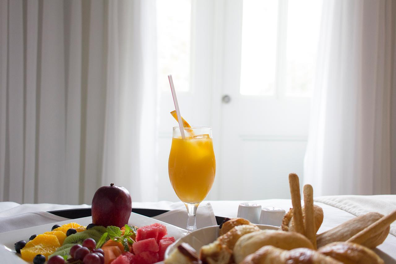 Central Hotel Panama Casco Viejo Ngoại thất bức ảnh A glass of orange juice
